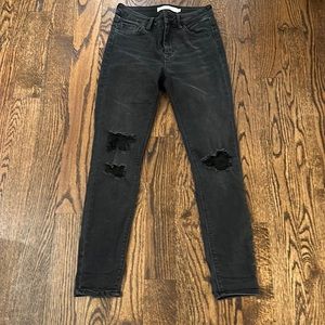 black ripped jeans - brand of jeans is hidden. Very good condition.